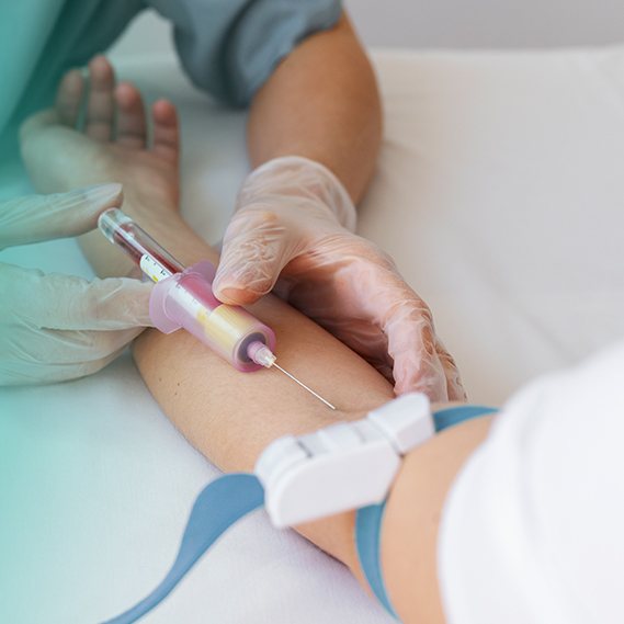A nurse drawing a blood sample for a vitamin D and B12 test at home