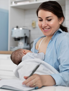 A mother breastfeeding her baby at home